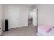 A bedroom features two doorways and a neutral carpet creating a quiet space ready for personalization at 302 N 69Th Pl, Mesa, AZ 85207