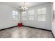 Bright dining room with tile flooring, a modern chandelier, and ample natural light at 302 N 69Th Pl, Mesa, AZ 85207