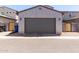 This single Gathering home features a garage with desert landscaping and easy street access at 302 N 69Th Pl, Mesa, AZ 85207