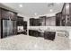 Well-equipped kitchen featuring stainless steel appliances and granite countertops at 302 N 69Th Pl, Mesa, AZ 85207