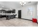 Open-concept kitchen featuring dark cabinetry, granite countertops, and a stylish breakfast bar at 302 N 69Th Pl, Mesa, AZ 85207