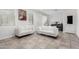 Cozy living room featuring neutral tile flooring and comfortable white seating at 302 N 69Th Pl, Mesa, AZ 85207