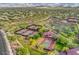 A high-angle shot captures multiple tennis courts, showcasing the recreational facilities of the community at 3336 W Morse Dr, Anthem, AZ 85086