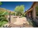 This cozy backyard features a built-in barbecue area, flagstone patio, and comfortable seating at 3336 W Morse Dr, Anthem, AZ 85086