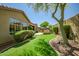 An artificial lawn, patio, and desert landscaping enhance this home's outdoor living space at 3336 W Morse Dr, Anthem, AZ 85086