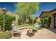 The backyard has a seating area around a fire pit and well-maintained landscaping at 3336 W Morse Dr, Anthem, AZ 85086