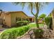 This low-maintenance backyard features artificial turf, desert landscaping, and a seating area at 3336 W Morse Dr, Anthem, AZ 85086