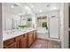 Bright bathroom with dual sinks, tile flooring, and a walk-in shower and tub offers comfort and style at 3336 W Morse Dr, Anthem, AZ 85086