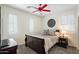 Bedroom with queen bed, wood frame, soft linens, and sunny windows with plantation shutters at 3336 W Morse Dr, Anthem, AZ 85086