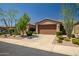 Well-maintained home featuring desert landscaping and a spacious driveway leading to the garage at 3336 W Morse Dr, Anthem, AZ 85086