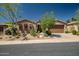 Charming single-story home featuring desert landscaping and a two-car garage at 3336 W Morse Dr, Anthem, AZ 85086