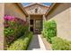 Inviting front entrance with stone accents, lush greenery, and a cozy seating area at 3336 W Morse Dr, Anthem, AZ 85086