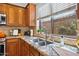 Well-lit kitchen featuring granite countertops, a stainless steel sink, and natural light at 3336 W Morse Dr, Anthem, AZ 85086