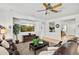 Comfortable living room features a ceiling fan and modern furnishings at 3336 W Morse Dr, Anthem, AZ 85086