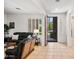 Bright living room with tile flooring, shutters, and an open doorway at 3336 W Morse Dr, Anthem, AZ 85086