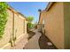 A side yard with desert landscaping and a walkway leads to the backyard at 3336 W Morse Dr, Anthem, AZ 85086