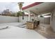 The backyard features a covered patio with outdoor kitchen, detached room and white gravel landscaping at 4115 W Sierra St, Phoenix, AZ 85029