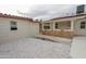 A white gravel path leads to the house with outdoor kitchen, pool, and bridge at 4115 W Sierra St, Phoenix, AZ 85029