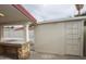Backyard featuring a covered bar area with a tiled countertop and an adjacent storage building at 4115 W Sierra St, Phoenix, AZ 85029