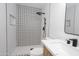 Modern bathroom featuring a glass shower, light wood-look vanity, and matte black hardware at 4115 W Sierra St, Phoenix, AZ 85029