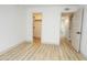 Bright bedroom featuring luxury vinyl flooring and access to a closet and bathroom at 4115 W Sierra St, Phoenix, AZ 85029