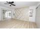 Bright bedroom featuring luxury vinyl flooring, access to the pool and accent wall at 4115 W Sierra St, Phoenix, AZ 85029