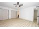Bright bedroom featuring luxury vinyl flooring, two closets and access to the bathroom at 4115 W Sierra St, Phoenix, AZ 85029