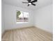 Bedroom with light walls and wood-look floors, and one window at 4115 W Sierra St, Phoenix, AZ 85029
