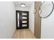 Modern entry with decorative mirror, stylish lighting, and sleek front door at 4115 W Sierra St, Phoenix, AZ 85029