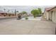 Home with modern features including white rock landscaping, covered drive, updated roof, and mature trees at 4115 W Sierra St, Phoenix, AZ 85029