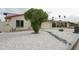 Well-maintained home with red roof, charming white rock landscaping, and mature, manicured shade tree at 4115 W Sierra St, Phoenix, AZ 85029