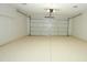 Well lit two car garage featuring overhead shelving at 4115 W Sierra St, Phoenix, AZ 85029