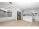 Bright kitchen area featuring white cabinetry, stainless steel appliances, and modern light fixtures at 4115 W Sierra St, Phoenix, AZ 85029