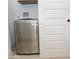 Convenient laundry nook with a sliding door next to the washing machine at 4115 W Sierra St, Phoenix, AZ 85029