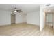 Spacious living room with stylish ceiling fan and laminate floors at 4115 W Sierra St, Phoenix, AZ 85029