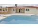 The backyard with diving board pool and patio offers ample space for outdoor enjoyment at 4115 W Sierra St, Phoenix, AZ 85029