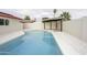 The backyard features a sparkling pool and a covered patio for relaxing and entertaining at 4115 W Sierra St, Phoenix, AZ 85029
