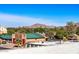 Scenic view of a building with green roofs and mountain backdrop under a bright blue sky at 4220 N 32Nd St # 21, Phoenix, AZ 85018