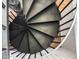 Modern staircase featuring a striking spiral design and sleek black metal finish at 4220 N 32Nd St # 21, Phoenix, AZ 85018