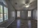 This bedroom features tile floors, lots of natural light from the shuttered windows, and a ceiling fan at 4255 E Rock Dr, San Tan Valley, AZ 85143