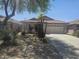 Charming single-story home with a tile roof and a well-maintained desert landscape at 4255 E Rock Dr, San Tan Valley, AZ 85143