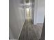 Hallway featuring wood-look tile flooring and neutral walls at 4255 E Rock Dr, San Tan Valley, AZ 85143