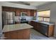 Well-equipped kitchen with stainless steel appliances and a granite-topped island at 4255 E Rock Dr, San Tan Valley, AZ 85143