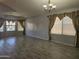 Spacious living room with large windows, neutral paint, and tile floors at 4255 E Rock Dr, San Tan Valley, AZ 85143