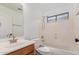Bathroom featuring a sink, toilet and bathtub with shower fixture at 45080 W Buckhorn Trl, Maricopa, AZ 85139