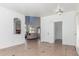 Spacious living room with beautiful tile flooring, neutral walls, and an open layout, perfect for entertaining guests at 45080 W Buckhorn Trl, Maricopa, AZ 85139