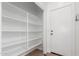 Walk-in pantry room with shelving for organization and extra storage at 45080 W Buckhorn Trl, Maricopa, AZ 85139