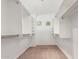 Walk-in closet featuring custom shelving and lots of room for storage at 45080 W Buckhorn Trl, Maricopa, AZ 85139
