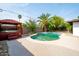 Inviting backyard pool and spa area, featuring a quaint gazebo and lush greenery for a relaxing oasis at 501 E Alameda Dr, Tempe, AZ 85282