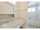Clean and simple bathroom featuring a vanity with integrated sink, mirrored medicine cabinet and walk in shower at 501 E Alameda Dr, Tempe, AZ 85282